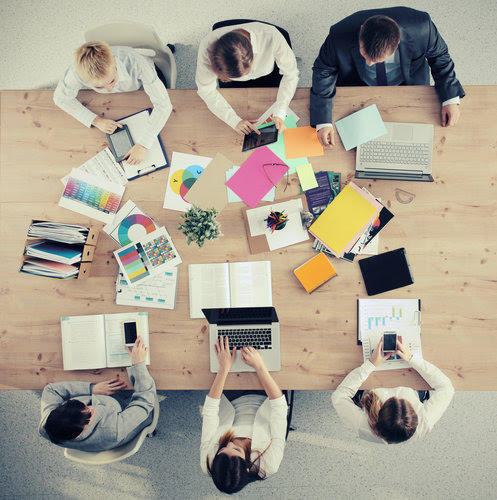 Business people sitting and discussing at business meeting